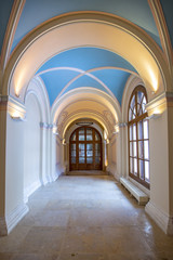 Fototapeta na wymiar Empty arched corridor in a religious building