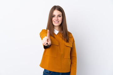 Young woman over isolated white background showing and lifting a finger