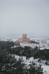 Landscape of a snowy town with a medieval castle