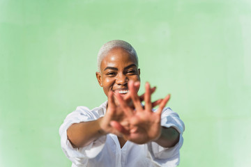 Portrait of laughing woman, showing her hands