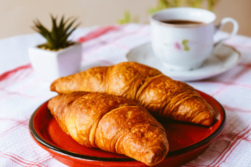 Croissant with cup of coffee