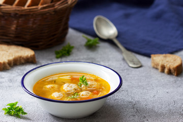 Dietary soup with meatballs, potatoes and noodles served with rye bread with bran. Children's menu.