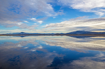 Fototapeta na wymiar Clouds reflected over lake in Klamath NWR, Oregon
