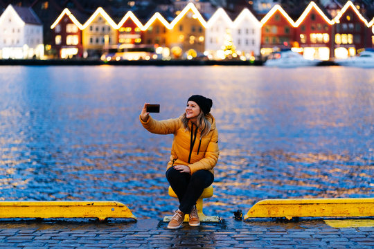 Woman taking a selfie, Bergen, Norway