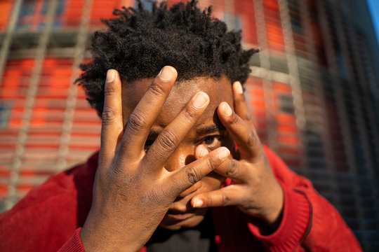 Portrait of mature man with hands on his face, Barcelona, Spain