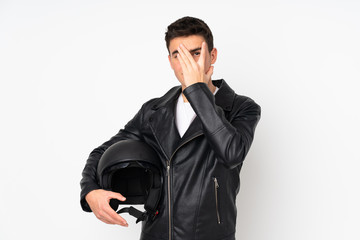 Man holding a motorcycle helmet isolated on white background covering eyes and looking through fingers