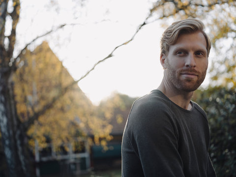 Portrait of content man in garden