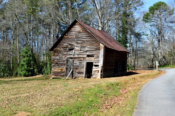 Old rustic abandoned farm barn shed at rural Georgia, USA