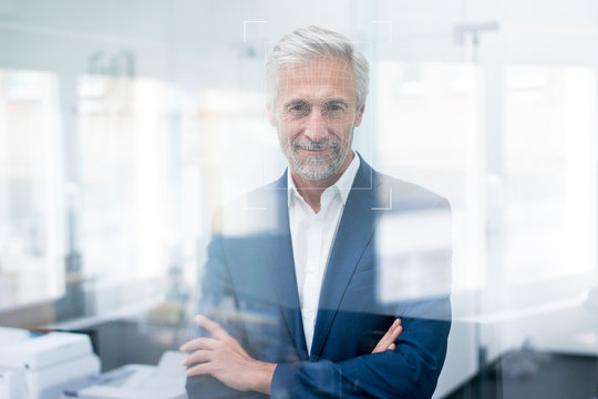 Portrait of businessman with grid over his face