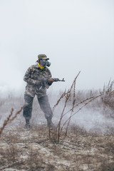 soldier walking through field looking for enemy