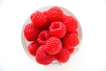 Fresh blackberries in a small glass on a white background. Healthy eating. Vegan food. Top view.