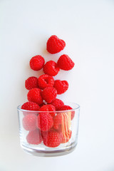 Fresh blackberries in a small glass on a white background. Healthy eating. Vegan food. Top view.