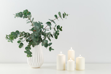 Bouquet of eucalyptus and candles © Lana_M