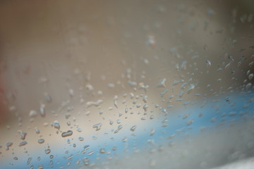 wet window with rain drops, selective focus.