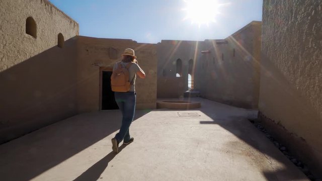 Young Foreign Female Tourist Visiting Ancient Bahla Fort in Oman