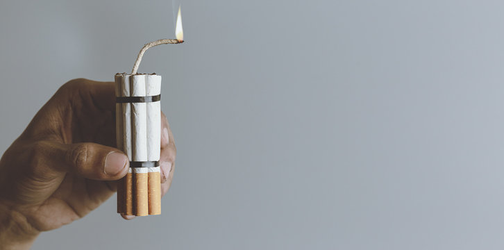 Man smoker.Cigarette like time bomb.Cigarettes is addictive to be cancer.smoking reduction campaign in World No Tobacco Day.