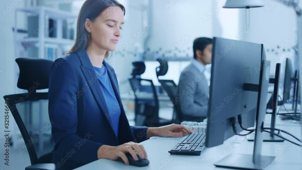 Poster portrait of young and confident industrial engineer working on computer, on screen cad software show