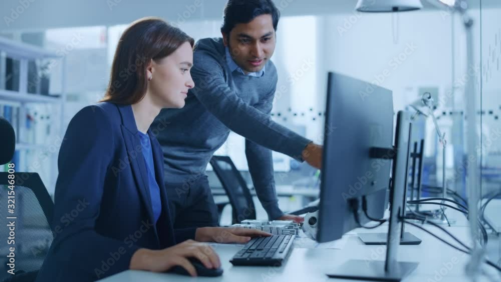 Poster modern factory office: male project supervisor talks to a female industrial engineer who works on co