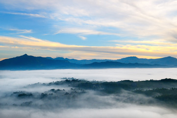 Sunrise in mountains, fog and cloud mountain valley landscape.