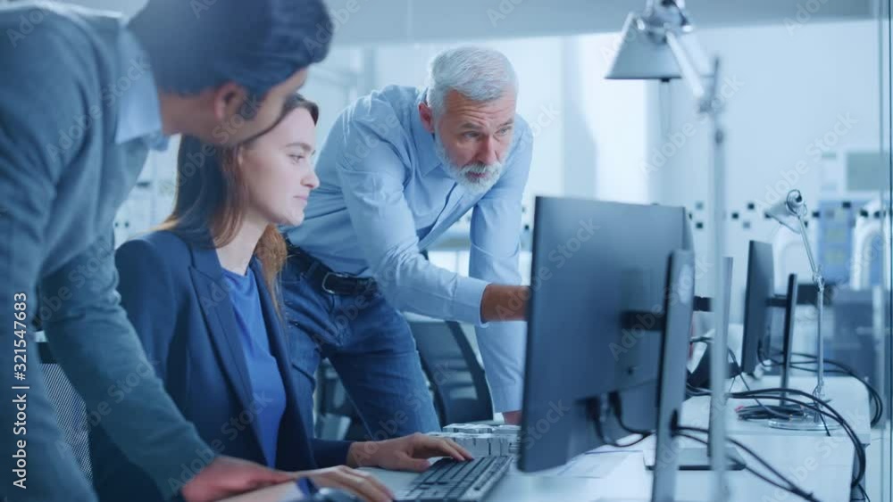 Poster modern factory office: project manager and supervisor talk to a female engineer works on computer. t