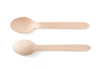Eco-friendly materials. Wooden, disposable spoon on a white background.