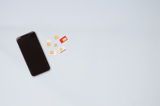Sim card put on white background. Sim card tray and eject tool Technology concept
