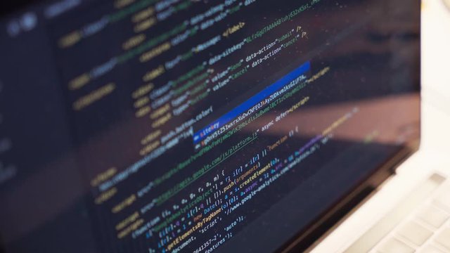 Writing code with Macbook computer