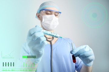 medical laboratory test tube and syringe with blood in the hand of a virologist doctor, concept of...