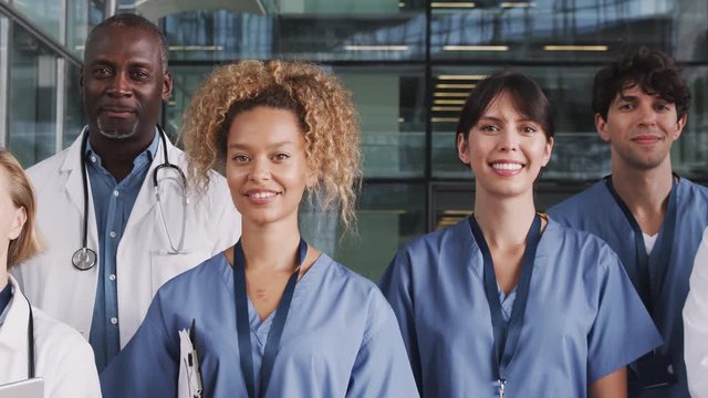Portrait Of Medical Team Standing In Modern Hospital Building