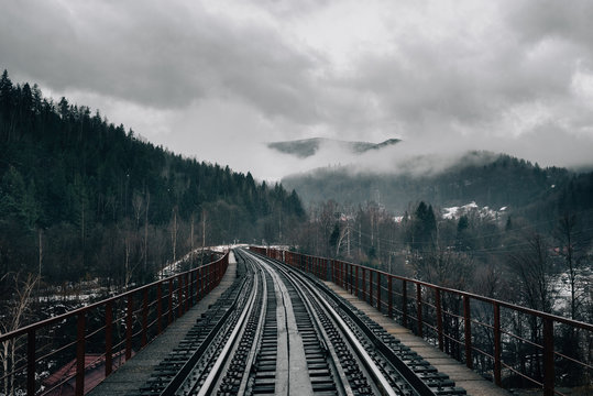 rails and sleepers, the railway goes into the distance. Beautiful mountain scenery.