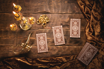 Tarot cards on fortune teller old desk background. Future reading.