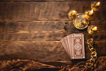 Tarot cards on fortune teller old desk background. Future reading.