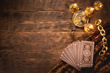 Tarot cards on fortune teller old desk background. Future reading.