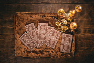 Tarot cards on fortune teller old desk background. Future reading.