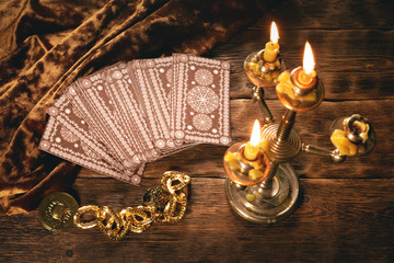 Tarot cards on fortune teller old desk background. Future reading.