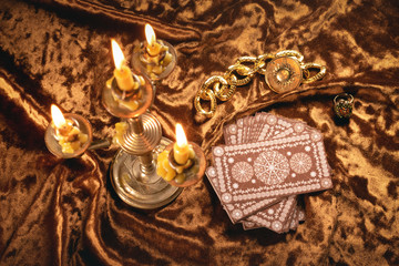 Tarot cards on fortune teller old desk background. Future reading.