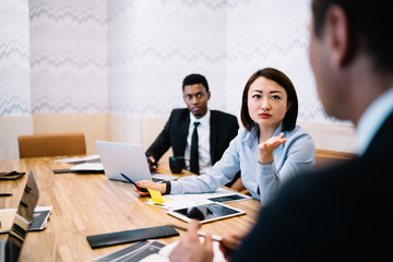 Multiracial entrepreneurs working in office