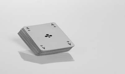 a stack of playing cards with reflection