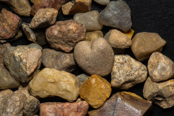 multicolored stones in close-up on a black background