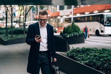 Cheerful man messaging in social media