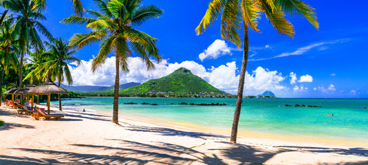 Amazing tropical scenery of beautiful beach and mountain view. Flic en Flac, Mauritius island