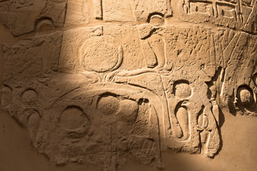 Karnak Temple, complex of Amun-Re. Embossed hieroglyphics on walls. Luxor Governorate, Egypt.