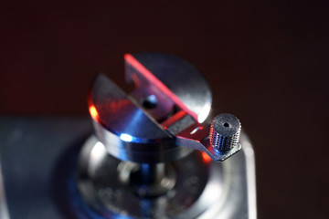 Small crank for film transport photographed on an old camera in the studio