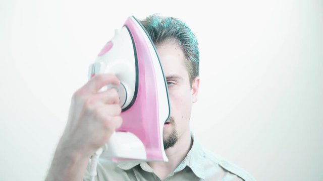 The Irony Man meme of a person ironing himself over face 4K