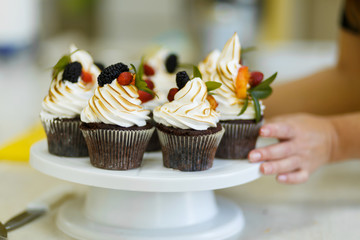 Plate with freshly baked sweet muffins. Sweet pastries, recipes, cooking
