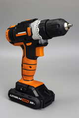 cordless drill screwdriver on a gray background