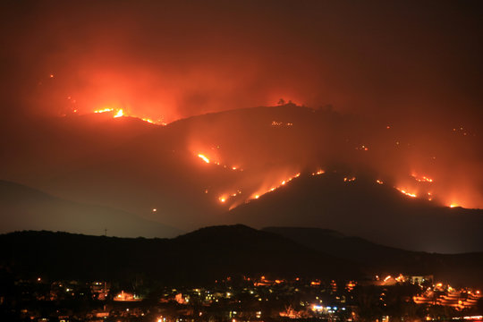 Mt. San Miguel on fire and raging toward homes in the Harris Fire of 2007.  San Diego wildfires.
