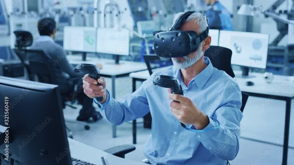 Leinwandbilder industrial design engineer wearing virtual reality headset and holding controllers, uses vr technolo