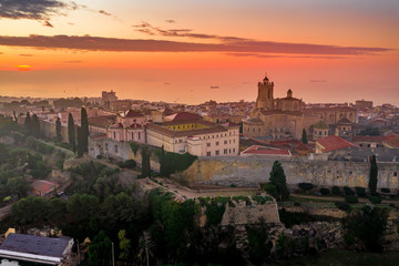 Obraz na płótnie Canvas Aerial sunrise view of the medieval walled center of Tarragona in Catalunya Spain with the cathedral, city walls, bastions and towers