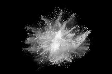 White powder explosion on black background. Colored cloud. Colorful dust explode. Paint Holi.